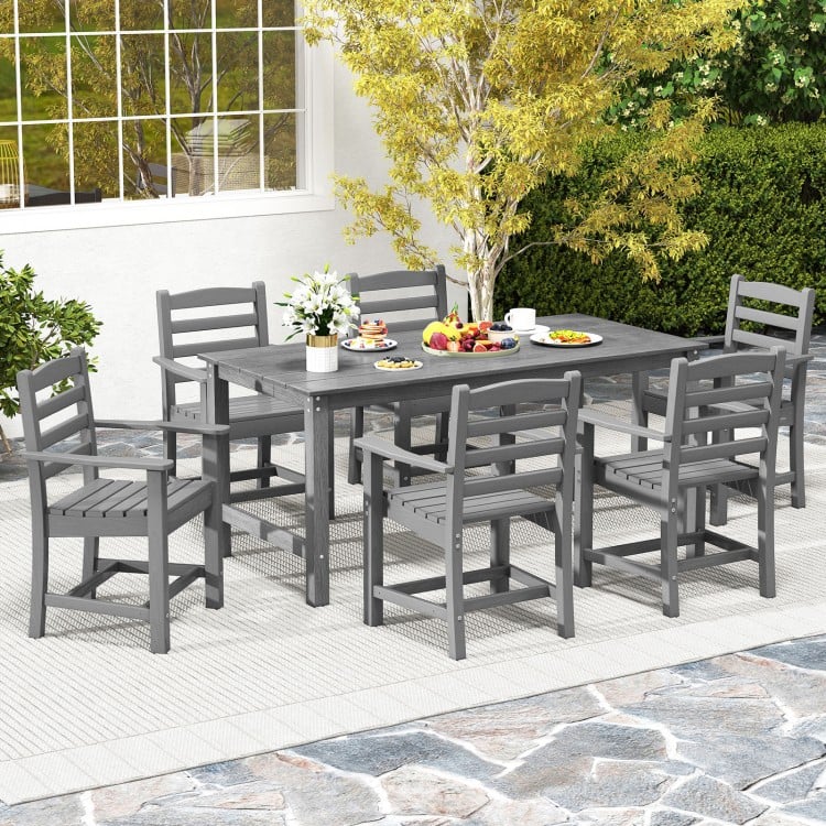 Gray HDPE outdoor dining set for 6, featuring sturdy chairs and a large table, perfect for outdoor dining in any season.