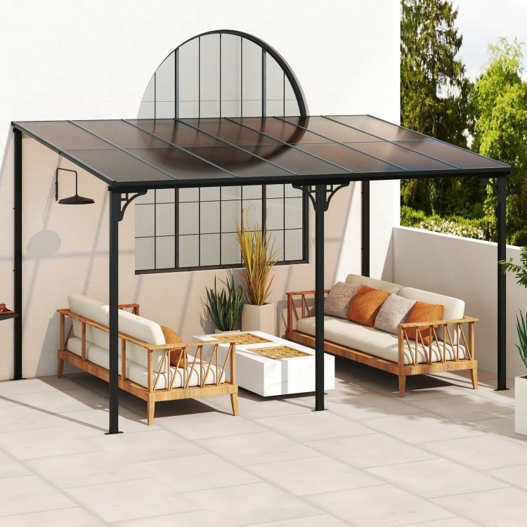 Large wall-mounted patio gazebo with a sloped polycarbonate roof, supported by a durable black metal frame for outdoor.