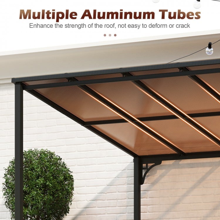 Close-up of the sloped polycarbonate roof of the black wall-mounted patio gazebo, featuring multiple aluminum tubes for.