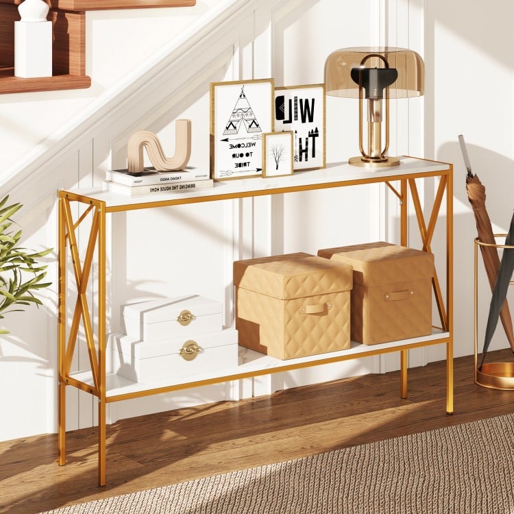 Narrow 2-tier console table with white faux marble top and gold X-shaped frame, perfect for entryways or small spaces.