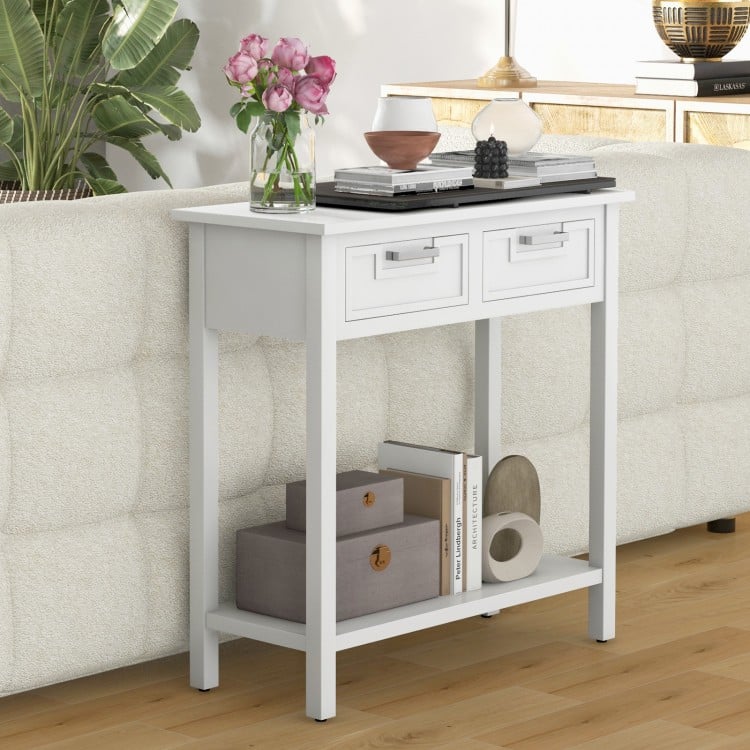 Narrow white console table with two drawers and open shelf, perfect for storing ornaments and books in any living space.