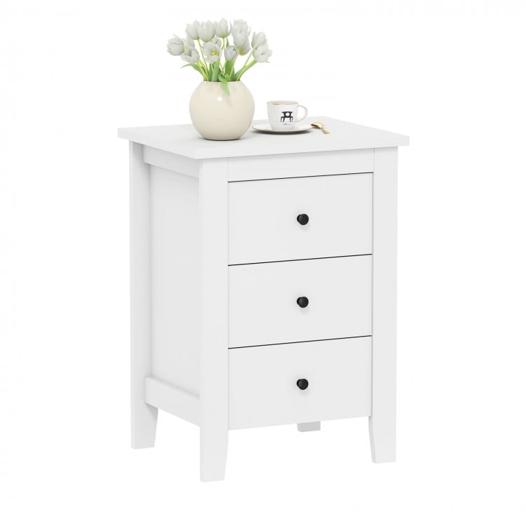 White nightstand with three sliding drawers, modern design, perfect for bedroom storage and enhancing home décor.