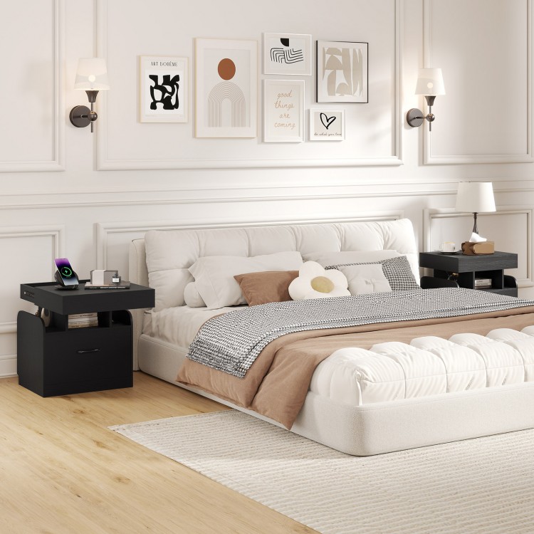 Modern black nightstand with charging station, sliding top storage, and three open compartments for organized bedroom.