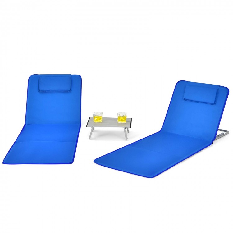 Two adjustable blue beach lounge chairs with a folding table, perfect for outdoor sunbathing and relaxation.