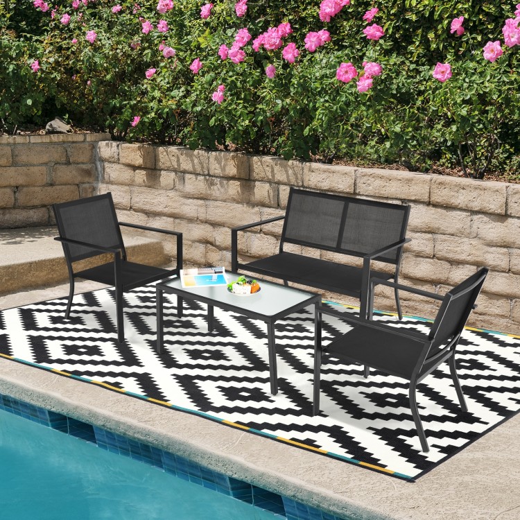 4-piece gray patio furniture set with steel frame, featuring a loveseat, chairs, and coffee table by the poolside.