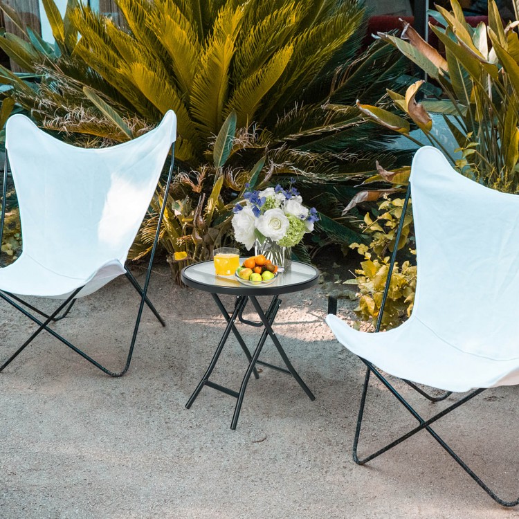 Compact patio side table with tempered glass tabletop, featuring a sturdy steel frame, perfect for outdoor gatherings.