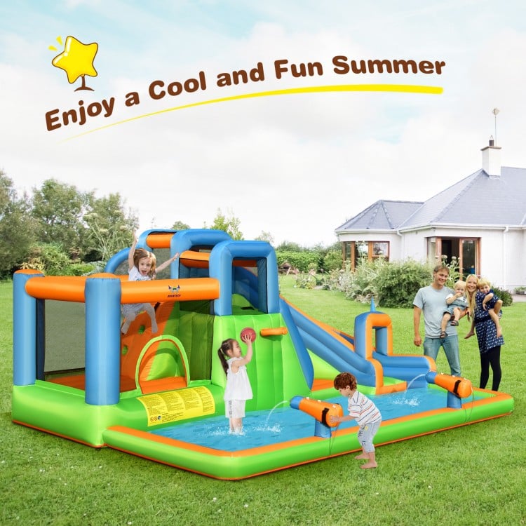 Inflatable giant water park bouncer with dual climbing walls, slide, and splash pool for summer fun in the backyard.