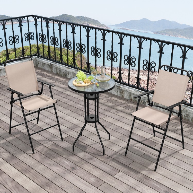 Outdoor bistro set featuring two beige folding chairs and a round table, perfect for patio or poolside relaxation.