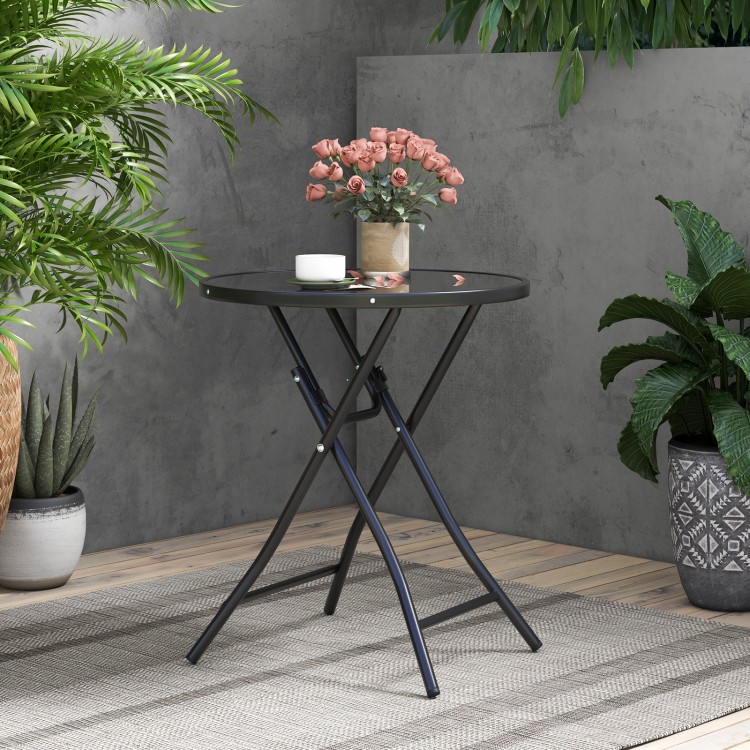 Round bistro table with tempered glass tabletop and sturdy metal frame, perfect for backyard or poolside use.