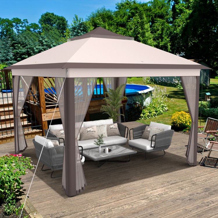 Pop-up 2-tier gazebo tent with beige canopy, mesh netting, and adjustable height for outdoor gatherings and protection.