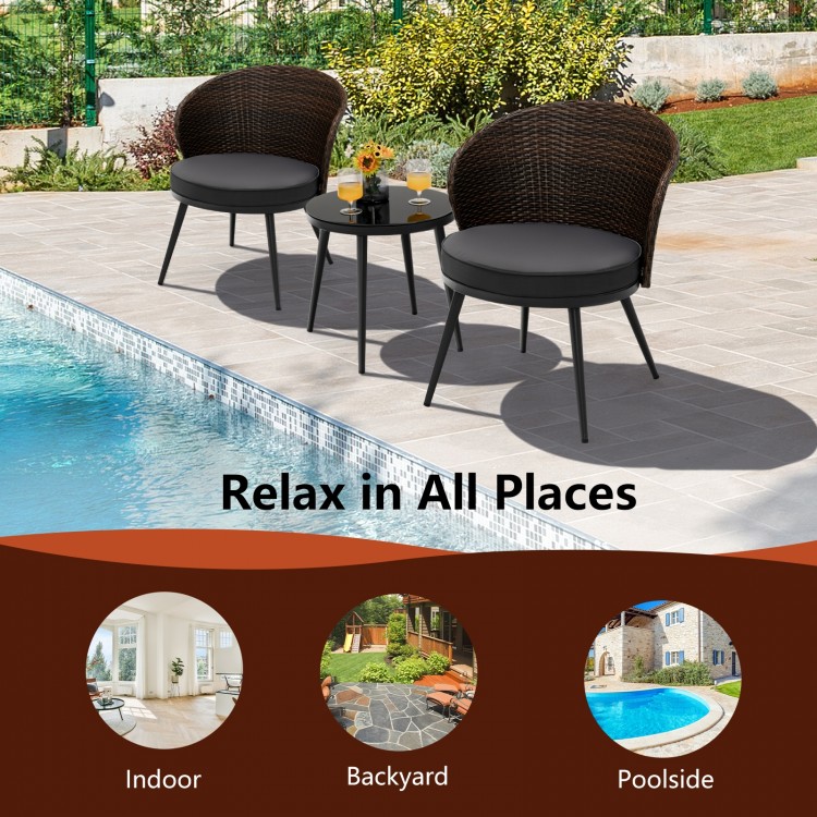 3-piece patio rattan bistro set with curved backrest and soft cushions, perfect for outdoor relaxation by the poolside.