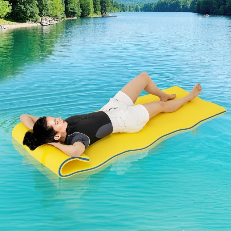 Yellow 3-layer tear-resistant foam floating pad with head support, ideal for lakes, pools, and beach relaxation.