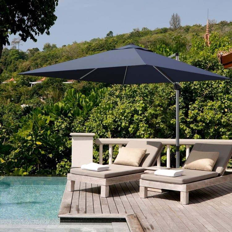 Navy 10 ft 360° tilt aluminum patio umbrella with sturdy ribs, providing shade for outdoor lounging by the pool.