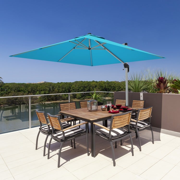 10 ft blue offset cantilever umbrella with aluminum pole and 360-degree tilt, perfect for shading patio dining sets.