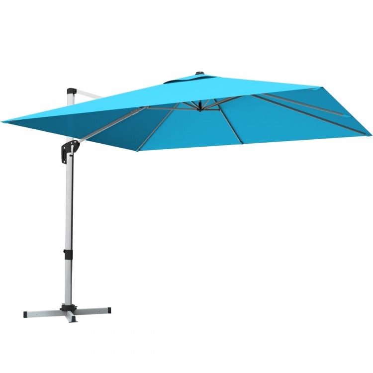 Blue 10 ft offset cantilever umbrella with aluminum pole, 360-degree rotation, and 7-position tilt for patio shading.