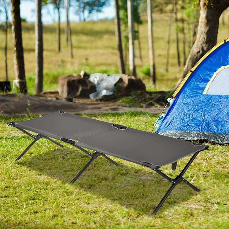 Gray folding camping cot with sturdy iron frame, portable design, ideal for camping, hiking, or office naps.