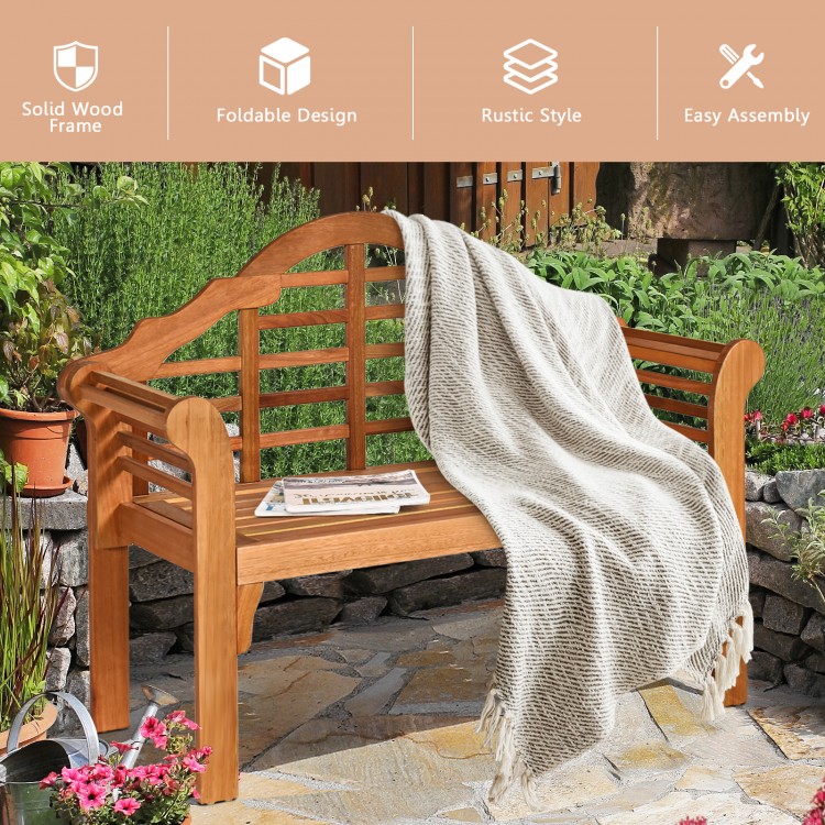 Rustic-style 49-inch eucalyptus wood folding bench with cozy blanket draped, ideal for garden or patio relaxation.