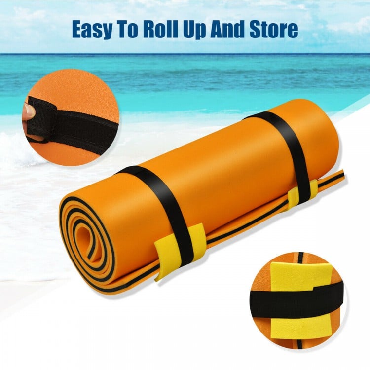 Rolled-up orange 3-layer water mat made of tear-resistant XPE foam, easy to store and carry for summer fun.