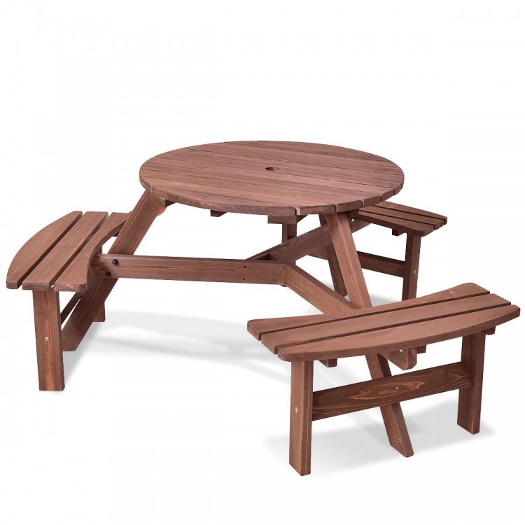 Round wooden picnic table set with benches, made of fir wood, seats 6, features an umbrella hole for outdoor gatherings.
