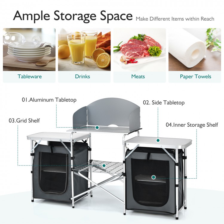 Folding camping table with gray aluminum tabletop, side tables, and storage organizer, ideal for outdoor picnics and.