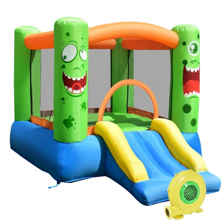Brightly colored inflatable castle bounce house with slide, mesh walls, and built-in basketball rim for kids' playtime.