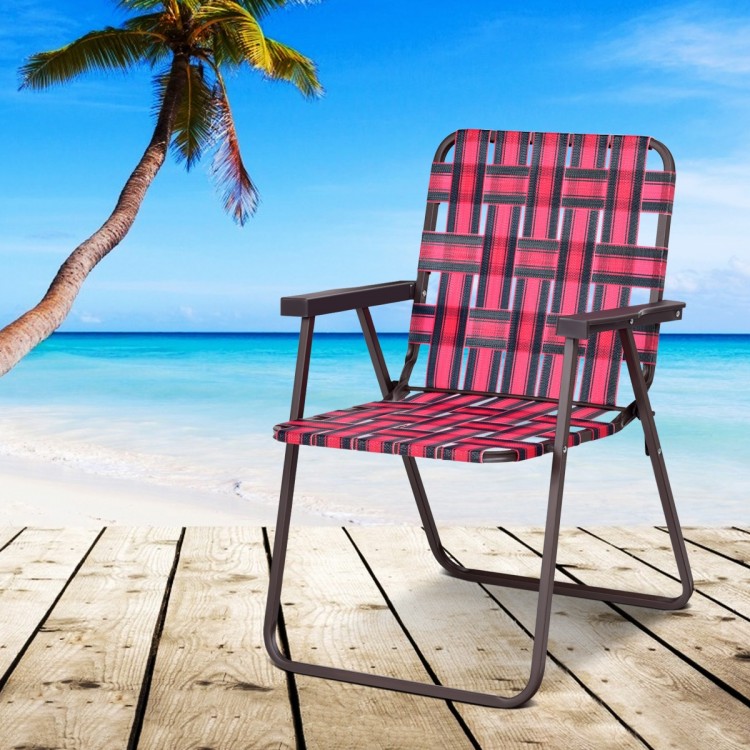 Red folding beach chair with durable webbing and steel frame, perfect for outdoor activities by the sea or poolside.