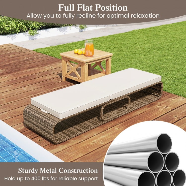 Adjustable PE rattan chaise lounge chair in full flat position, supports up to 400 lbs, perfect for poolside relaxation.