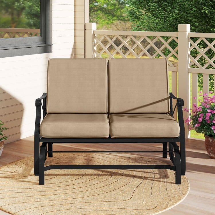 Outdoor 2-person glider rocking chair loveseat with thick cushions and metal frame, perfect for patio relaxation.