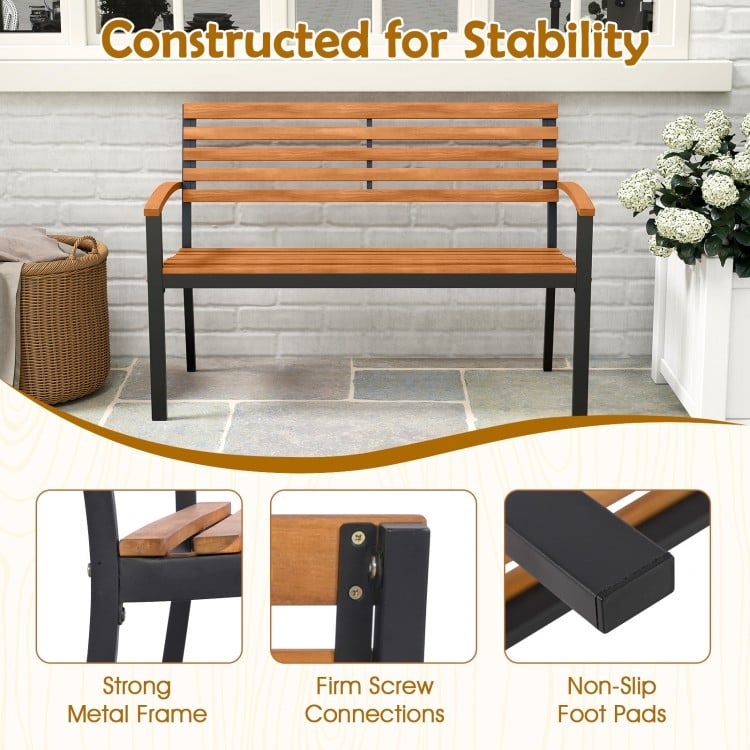 Acacia wood outdoor bench with backrest and armrests, featuring a strong metal frame and non-slip foot pads for.