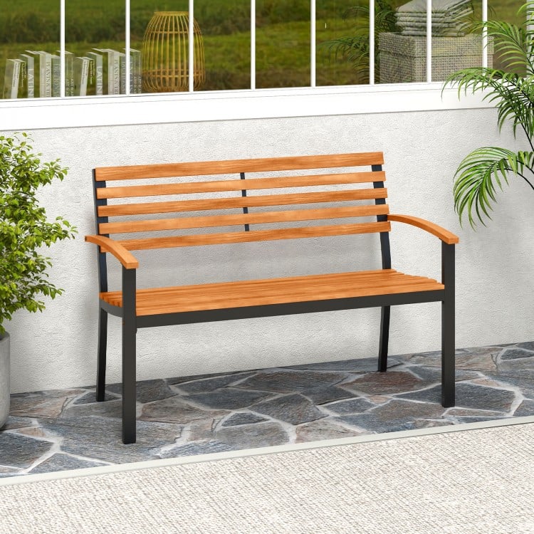 Acacia wood outdoor bench with backrest and armrests, ideal for patio or garden seating for two.