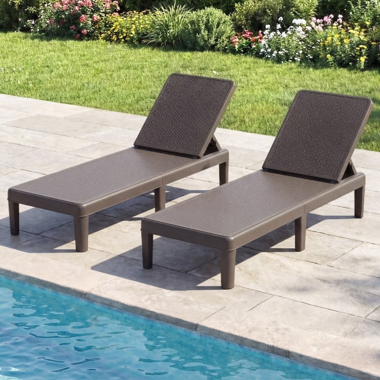 Brown outdoor chaise lounger chairs with waterproof rattan texture, adjustable backrest, perfect for sunbathing by the.