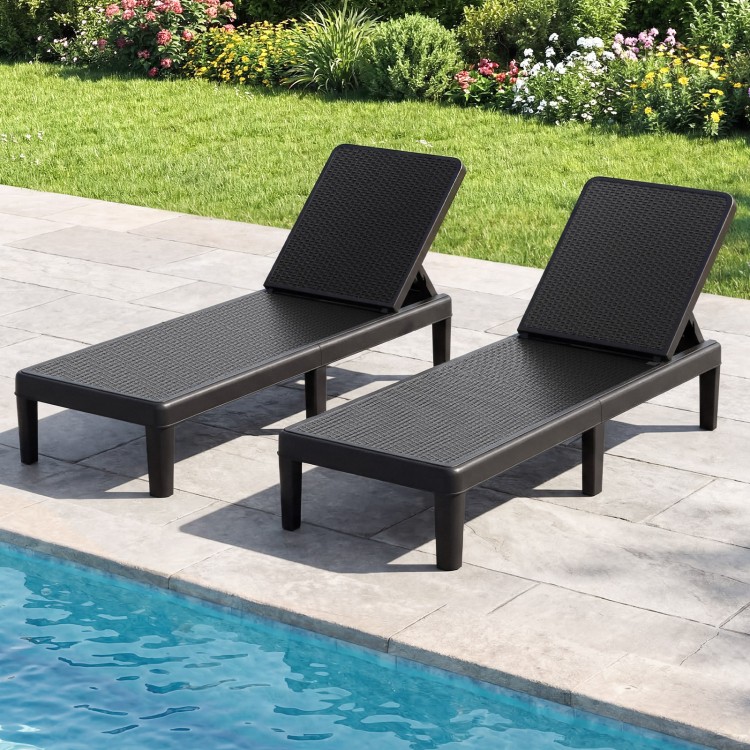 Black outdoor chaise lounger chairs with waterproof rattan texture, adjustable backrest, perfect for sunbathing by the.
