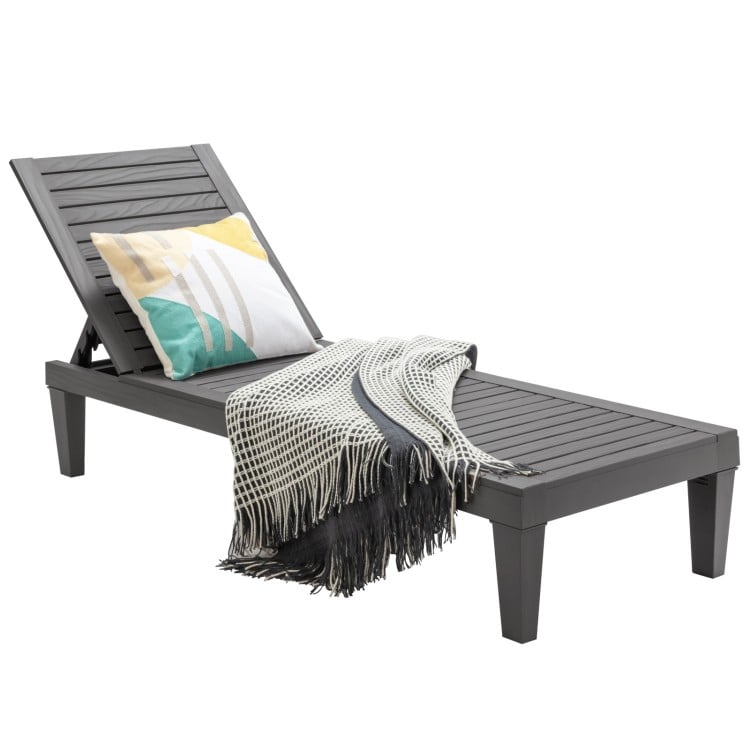 Grey outdoor chaise lounge chair featuring a stylish design and comfortable cushion, ideal for garden or backyard use.