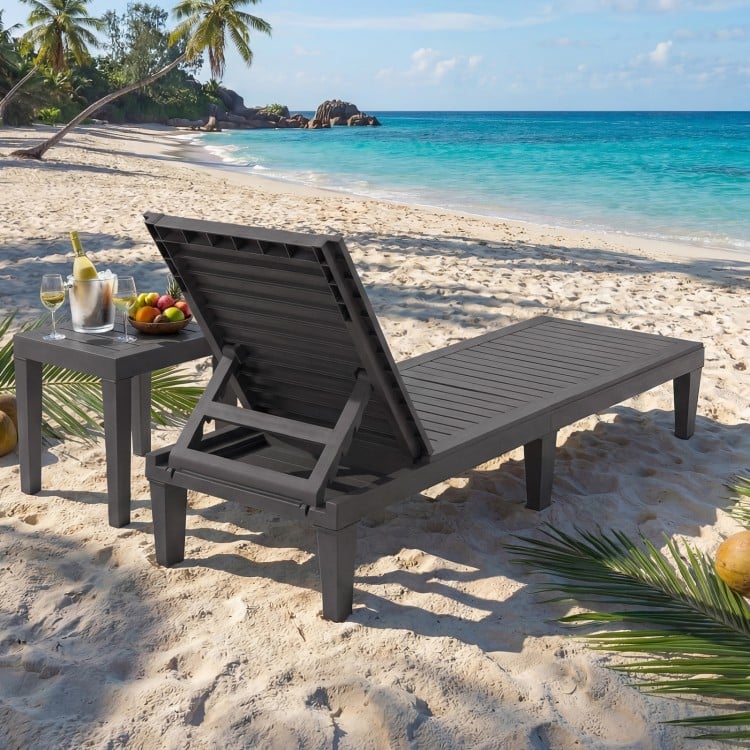 Grey outdoor chaise lounge chair with adjustable backrest, perfect for poolside relaxation and easy transport.
