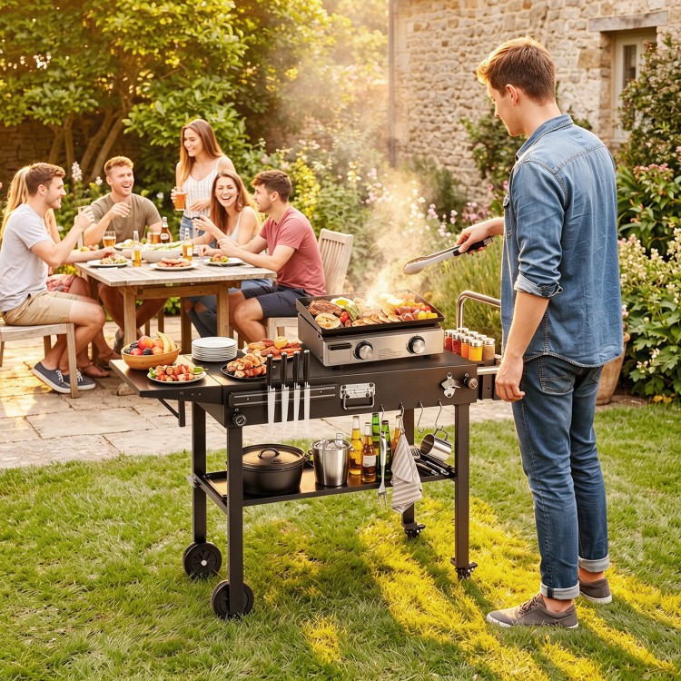 Portable outdoor grill cart with large directional wheels, ergonomic handle, and ample storage for a seamless cooking experience.