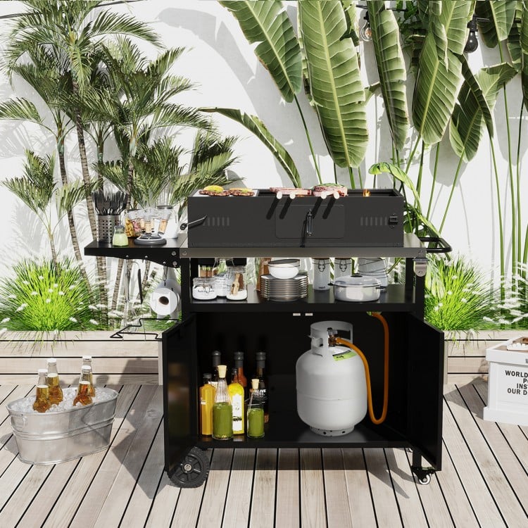 Outdoor grill cart with a folding stainless steel top, featuring ample storage and wheels for easy mobility, perfect.