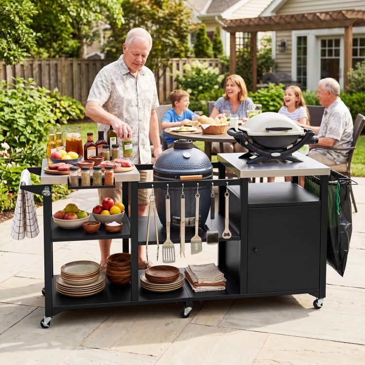Outdoor grill cart with stainless steel tabletops, hooks, and storage shelves, perfect for family gatherings and BBQs.