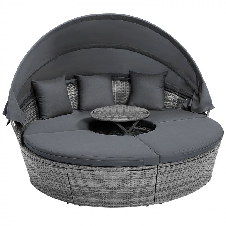 Round outdoor daybed with retractable canopy and gray PE wicker, featuring cushions for comfort, ideal for backyard.