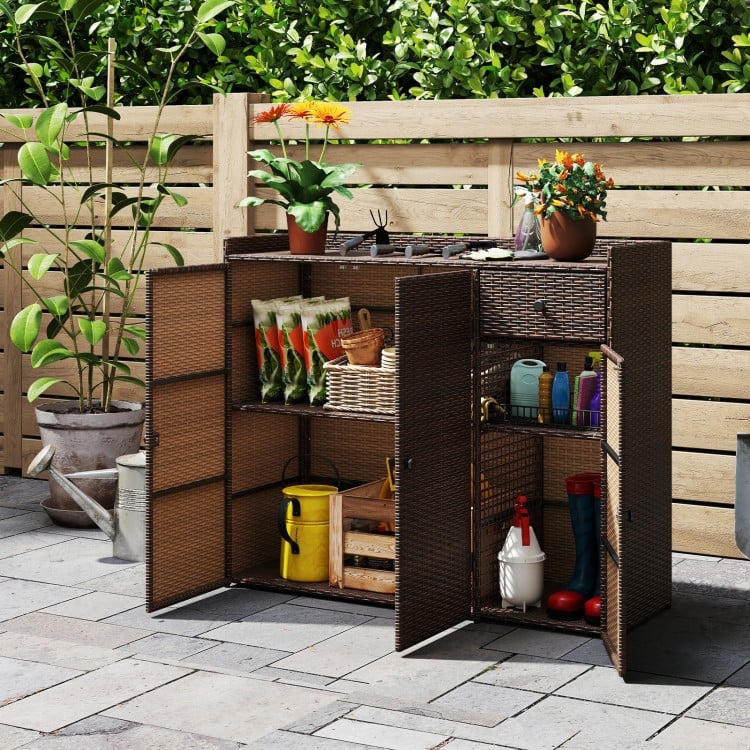 Outdoor PE wicker storage cabinet with three doors, featuring adjustable shelves and a wide countertop for deck.