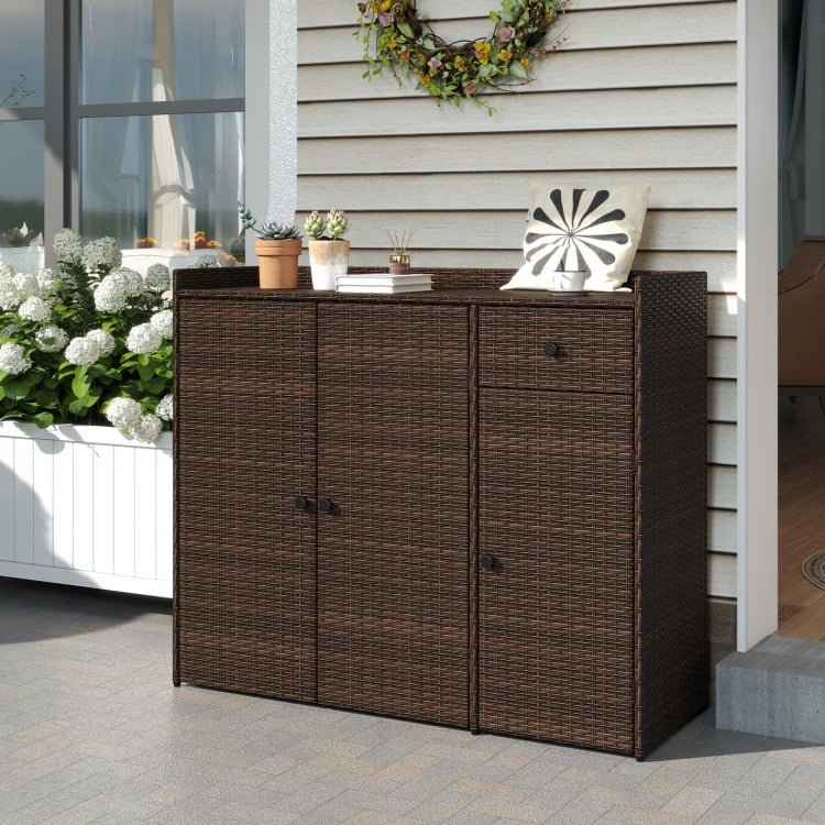 Outdoor PE wicker storage cabinet with three doors, featuring a stylish design and adjustable foot pads for uneven.