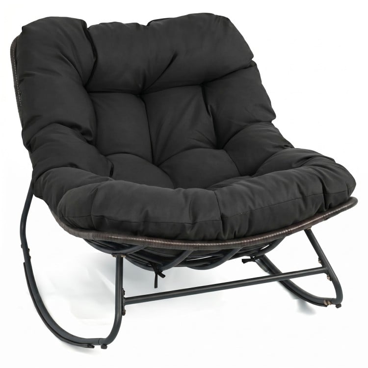 Black outdoor Papasan rocking chair with thick cushion, ergonomic design, and sturdy metal frame for comfortable.