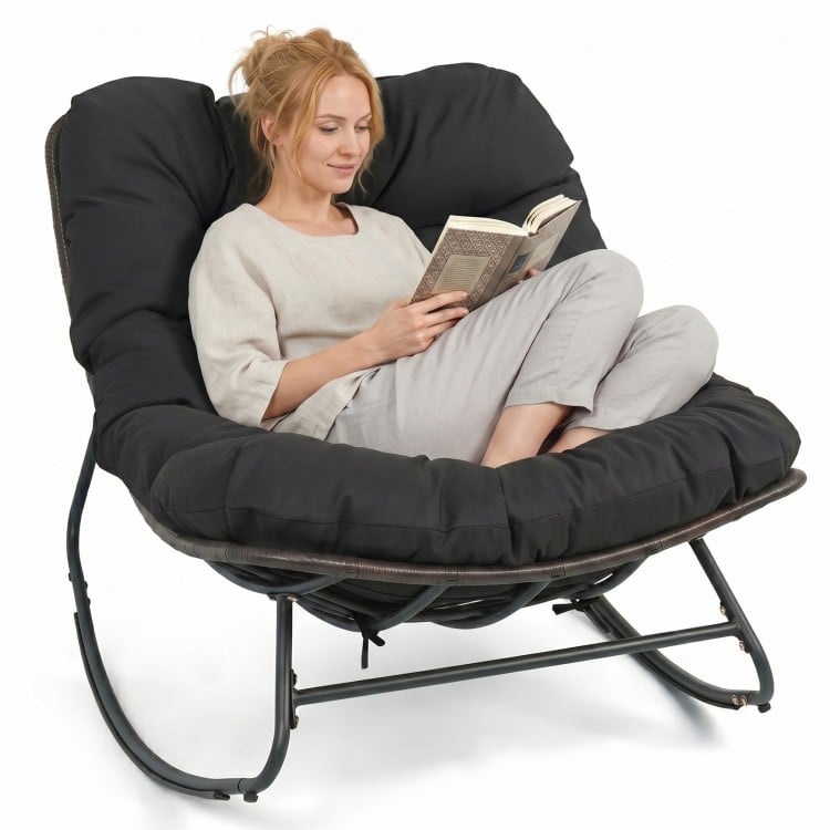 Outdoor Papasan rocking chair with thick black cushion, designed for comfort and support, perfect for outdoor.