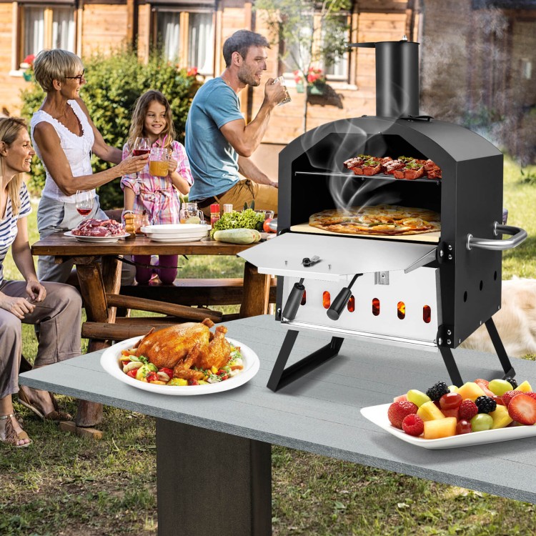 Outdoor pizza oven with foldable legs, cooking two pizzas at once, ideal for backyard gatherings and versatile cooking.