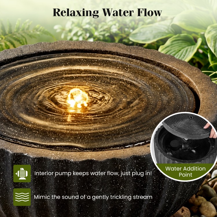 Outdoor round sphere water fountain with LED lights, featuring a relaxing water flow and durable resin build for.