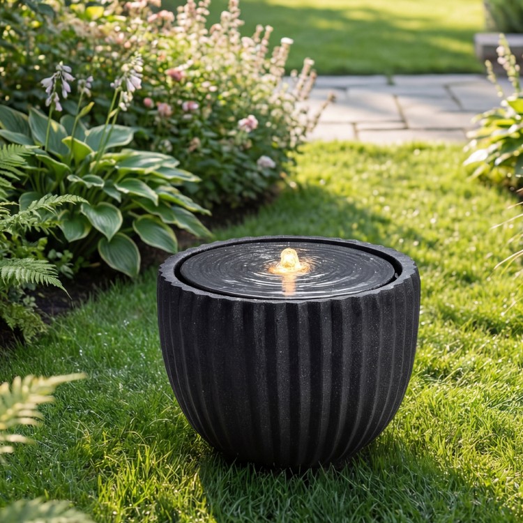 Round sphere water fountain with pump, featuring a realistic stone look and LED lights, perfect for garden tranquility.