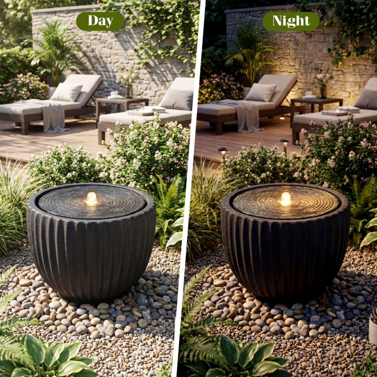 Outdoor round sphere water fountain with pump, featuring a realistic stone look and warm white LED lights for garden.