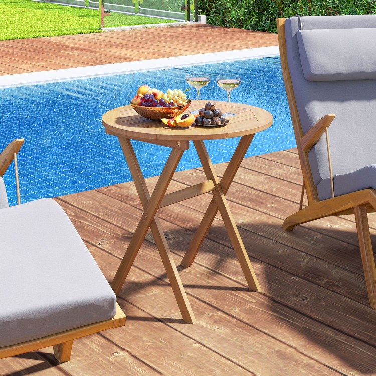 Outdoor side table with slatted tabletop, made of acacia wood, perfect for poolside relaxation and easy storage.