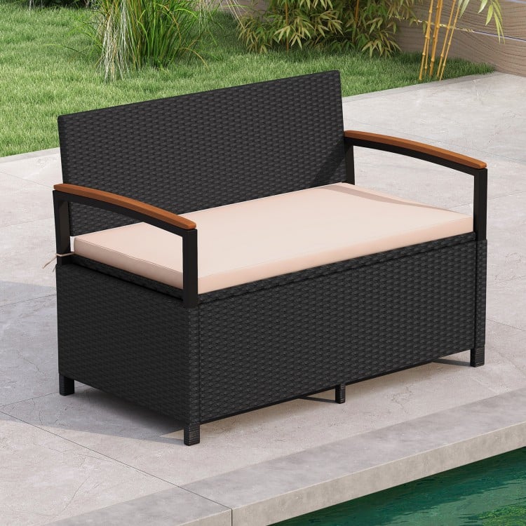 Outdoor storage bench with brown cushion, made of anti-fading PE rattan, ideal for patio or poolside seating.