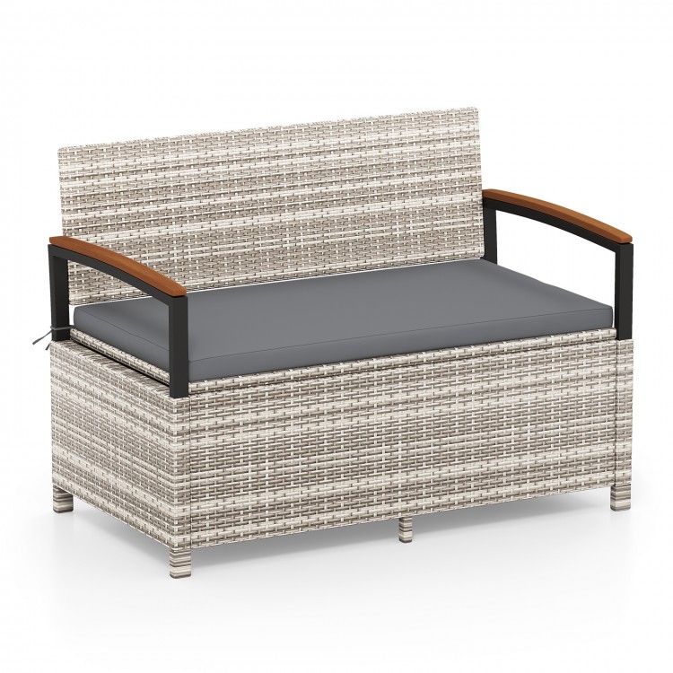 Outdoor storage bench with gray cushion, made of anti-fading PE rattan, ideal for patio or garden seating.