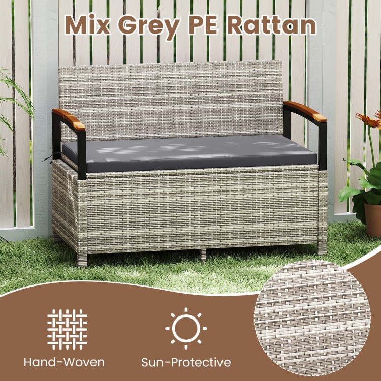 Outdoor storage bench in mix grey PE rattan with cushion, featuring acacia wood armrests for patio or garden use.